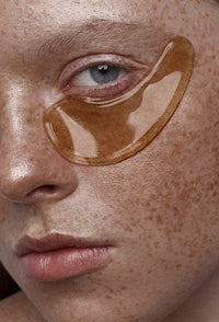 a woman with freckles on her face